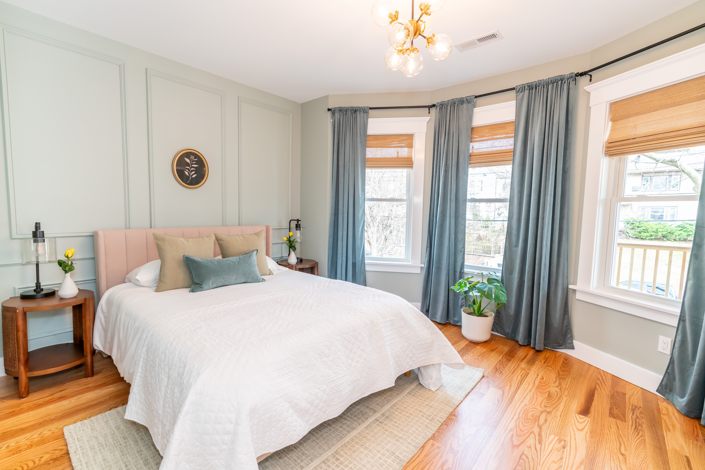 Bright bedroom with ample closet space and hardwood floors