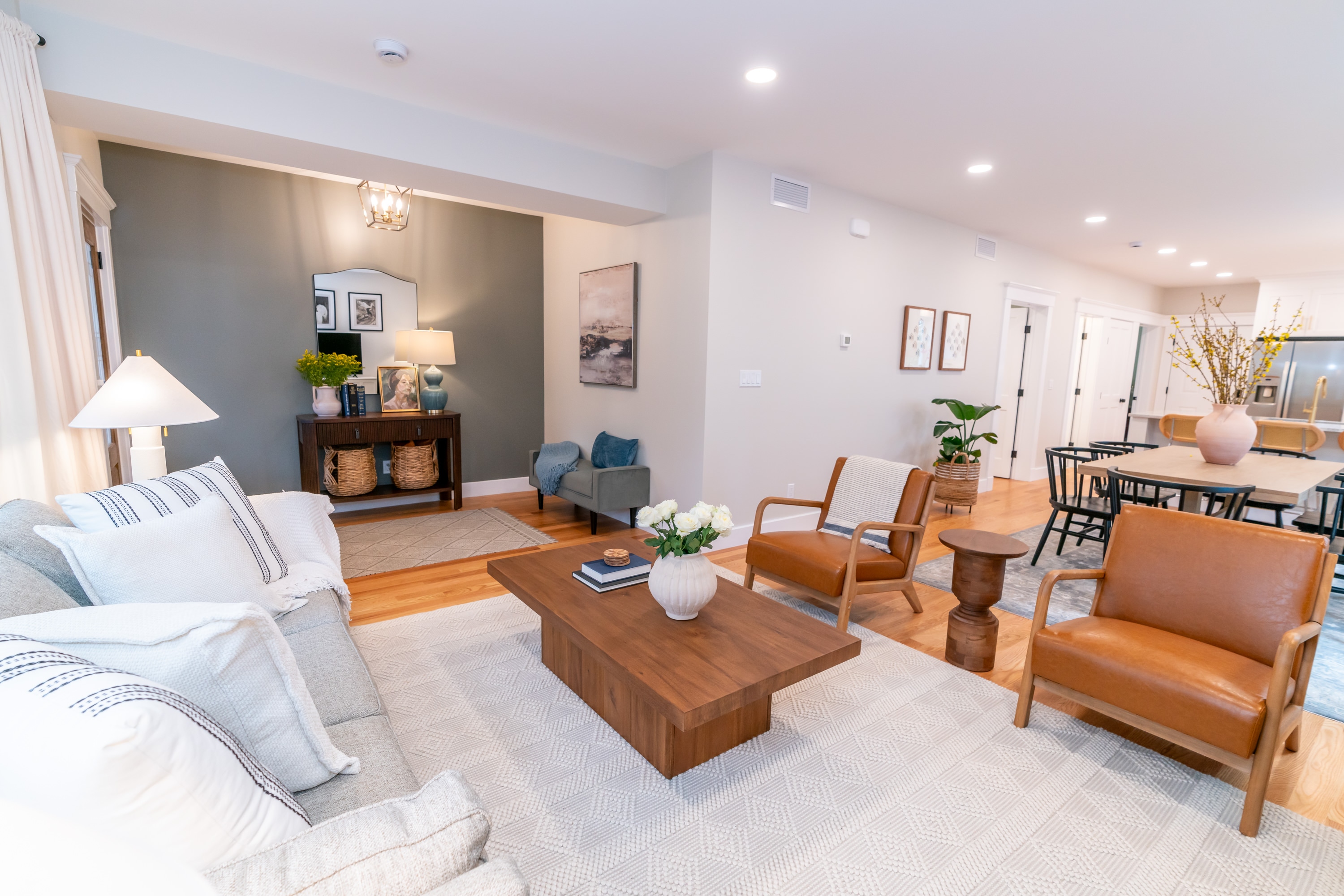 Spacious living room with hardwood floors and natural light